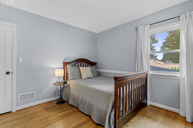 5707 SW Menefee Dr, Portland, OR 97239 - bedroom with wood finished floors and baseboards