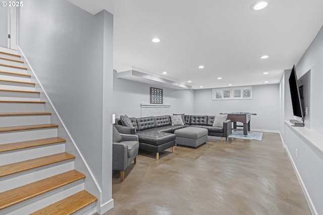 5707 SW Menefee Dr, Portland, OR 97239 - living room featuring recessed lighting, stairway, concrete floors, and bar