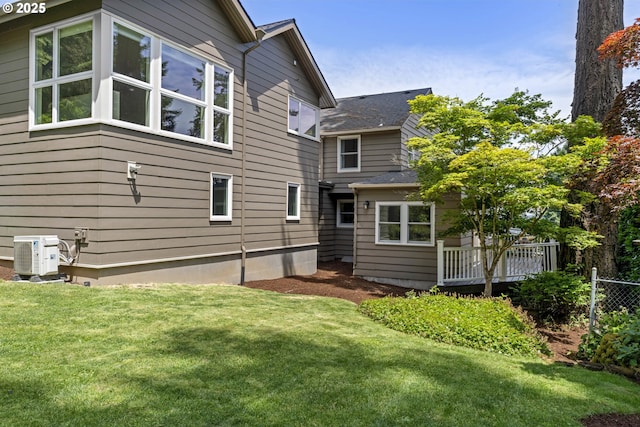 5707 SW Menefee Dr, Portland, OR 97239 - back of property featuring a lawn