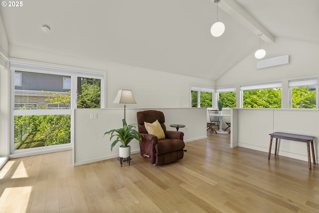 5707 SW Menefee Dr, Portland, OR 97239 - living area with plenty of natural light, beamed ceiling, light wood-style flooring, and high vaulted ceiling