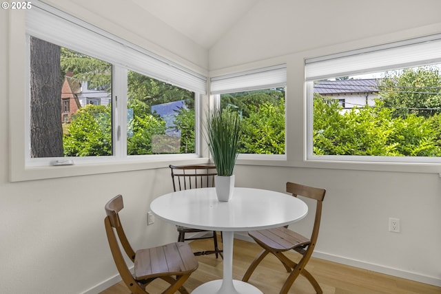 5707 SW Menefee Dr, Portland, OR 97239 - dining area featuring wood finished floors and vaulted ceiling