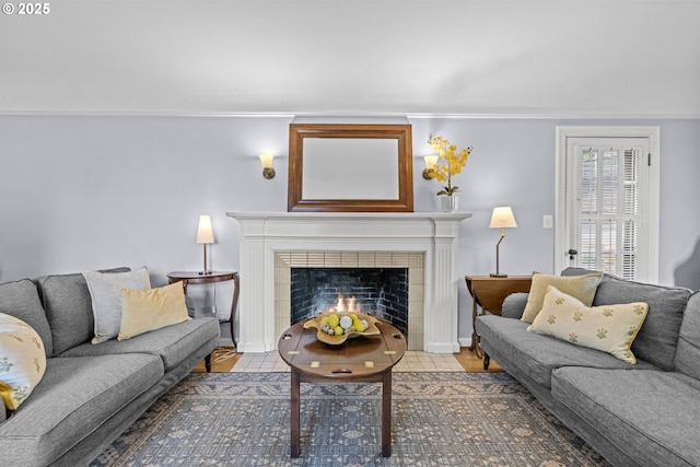 5707 SW Menefee Dr, Portland, OR 97239 - living room with a fireplace, wood finished floors, and ornamental molding