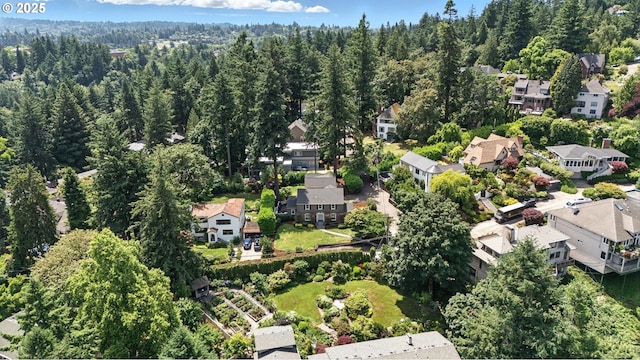 5707 SW Menefee Dr, Portland, OR 97239 - aerial overview of property's location with nearby suburban area and a forest