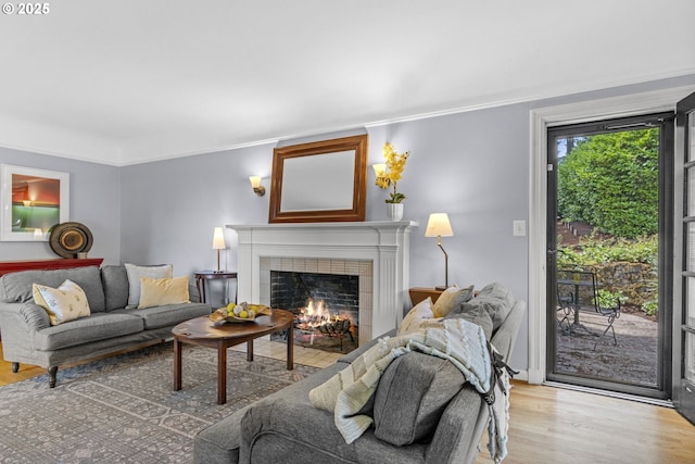 5707 SW Menefee Dr, Portland, OR 97239 - living area with a fireplace, wood finished floors, and ornamental molding