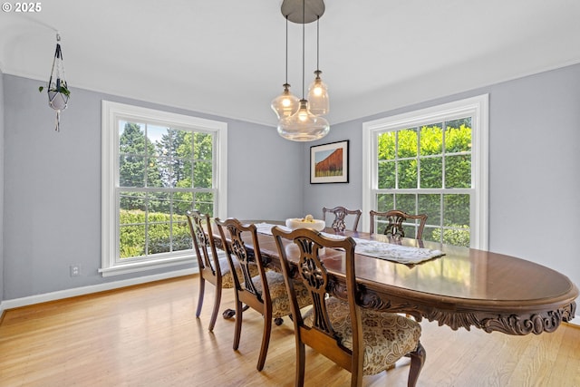 5707 SW Menefee Dr, Portland, OR 97239 - dining space with light wood-style flooring and crown molding