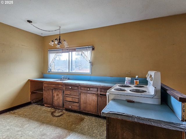 kitchen with pendant lighting, an inviting chandelier, sink, white electric range oven, and a textured ceiling