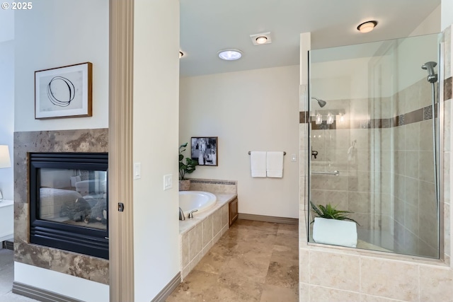 bathroom featuring a fireplace and plus walk in shower