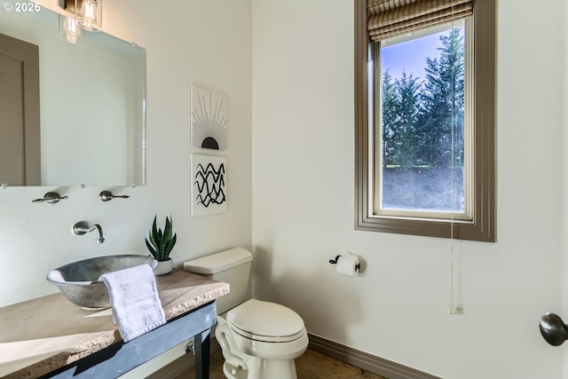 bathroom featuring toilet and sink