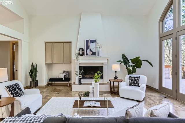 living room featuring a towering ceiling