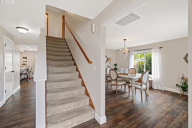 4931 NE Mink Ct, Salem, OR 97305 - staircase featuring wood finished floors and a chandelier