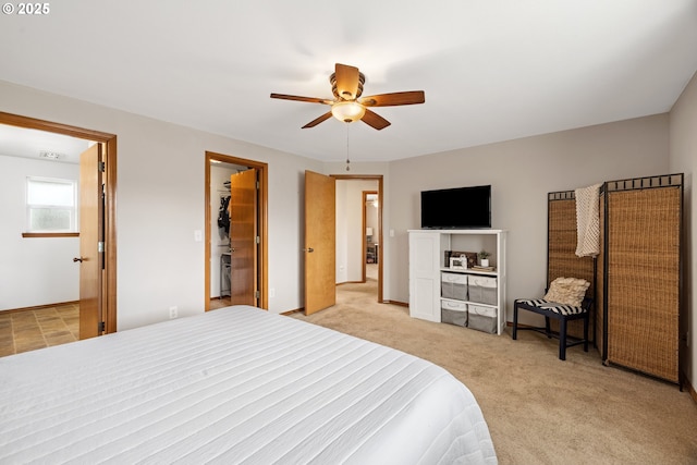 4931 NE Mink Ct, Salem, OR 97305 - bedroom with light colored carpet, ceiling fan, and a walk in closet