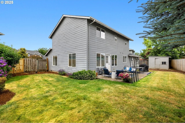 4931 NE Mink Ct, Salem, OR 97305 - rear view of house featuring a fenced backyard, a storage shed, a patio, and outdoor lounge area