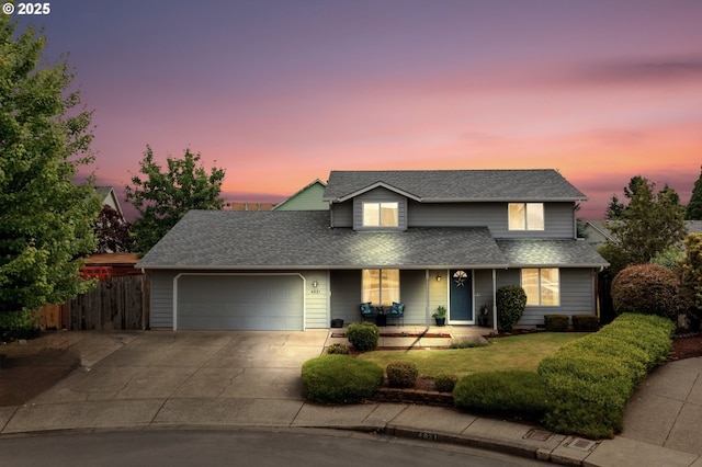 4931 NE Mink Ct, Salem, OR 97305 - traditional home featuring an attached garage, covered porch, driveway, and roof with shingles