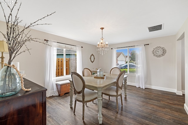 4931 NE Mink Ct, Salem, OR 97305 - dining space featuring dark wood-style floors and a chandelier