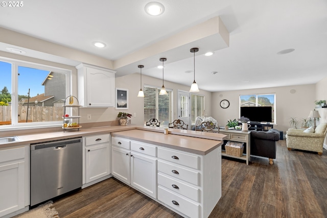 4931 NE Mink Ct, Salem, OR 97305 - kitchen with stainless steel dishwasher, dark wood finished floors, a peninsula, light countertops, and recessed lighting