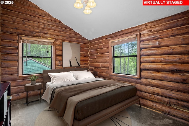 bedroom featuring rustic walls, carpet, a chandelier, and lofted ceiling