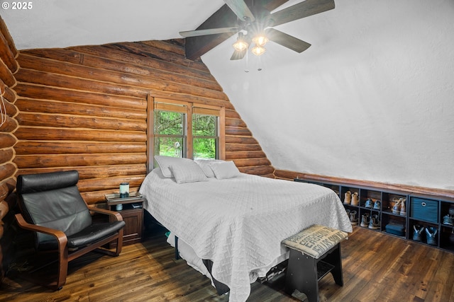 bedroom with ceiling fan, log walls, lofted ceiling, and wood finished floors