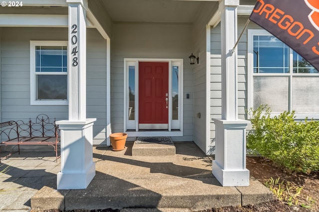 doorway to property with a porch