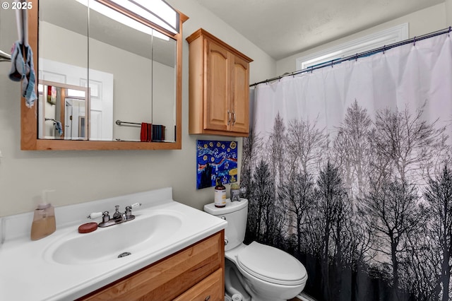 2117 Kauffman Ave, Vancouver, WA 98660 - bathroom featuring toilet, vanity, and a shower with shower curtain