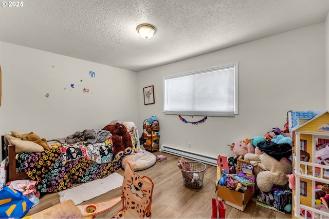 2117 Kauffman Ave, Vancouver, WA 98660 - bedroom with baseboard heating, a textured ceiling, and wood finished floors