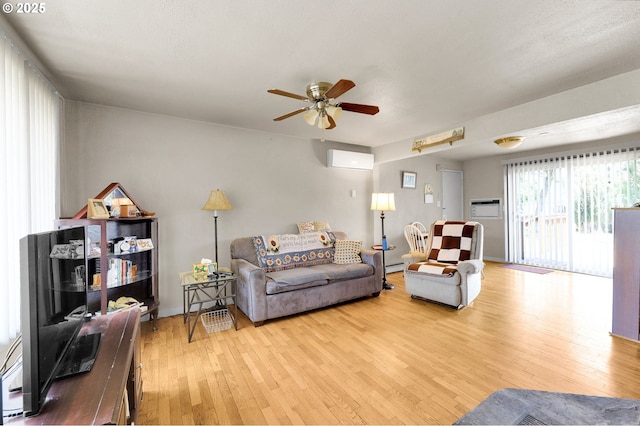 695 32nd St, Springfield, OR 97478 - living area with a ceiling fan, light wood-style floors, and a wall mounted AC