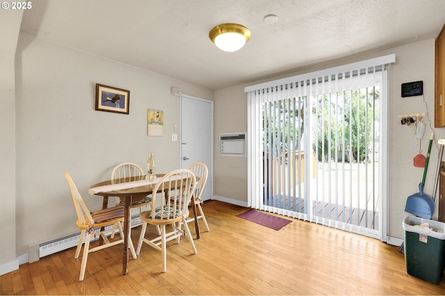 695 32nd St, Springfield, OR 97478 - dining room featuring light wood-type flooring and an AC wall unit