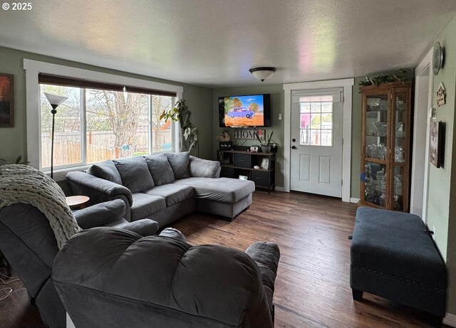 living room featuring baseboards and wood finished floors