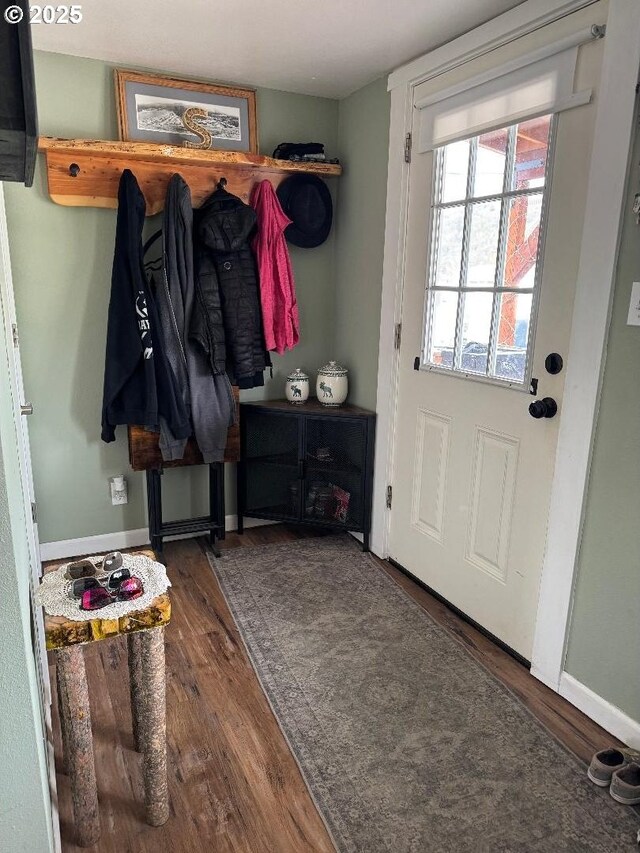 mudroom featuring baseboards and wood finished floors