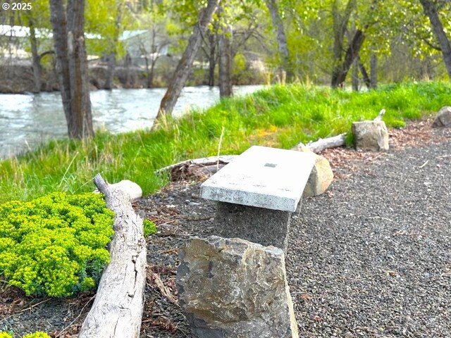 view of storm shelter with a water view