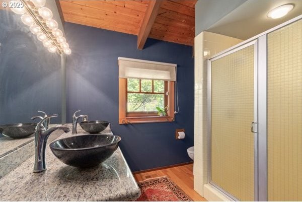 86595 N Modesto Dr, Eugene, OR 97402 - bathroom featuring wood ceiling, wood finished floors, a shower stall, vanity, and toilet
