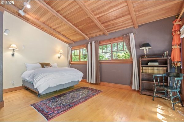 86595 N Modesto Dr, Eugene, OR 97402 - bedroom with wooden ceiling, wood finished floors, and baseboards