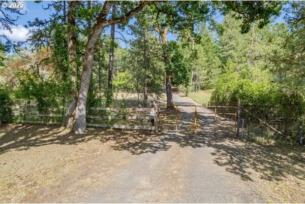 86595 N Modesto Dr, Eugene, OR 97402 - view of dirt / gravel road featuring a gate
