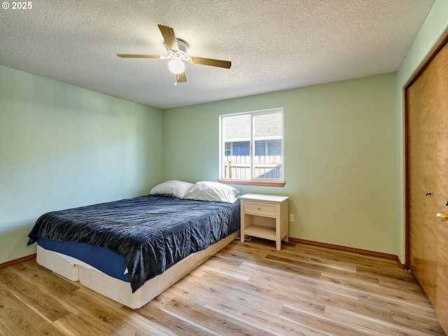 1201 Meadow Dr, Molalla, OR 97038 - bedroom with light wood-type flooring, a textured ceiling, ceiling fan, and a closet