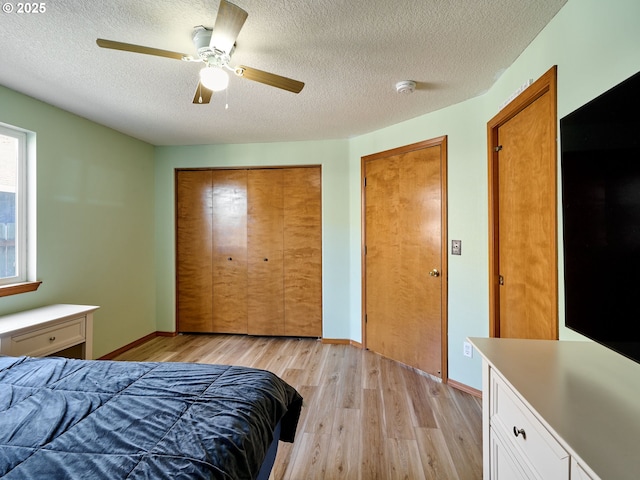 1201 Meadow Dr, Molalla, OR 97038 - bedroom featuring a textured ceiling, light wood finished floors, and ceiling fan