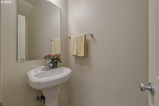 bathroom with a textured wall