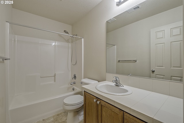 full bath featuring a textured ceiling, toilet, vanity, visible vents, and tub / shower combination