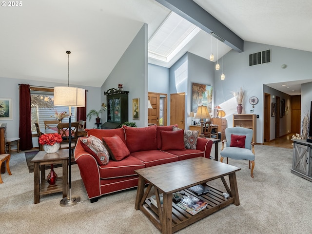 carpeted living room featuring visible vents, beamed ceiling, and high vaulted ceiling