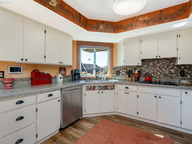 kitchen featuring black electric cooktop, backsplash, dishwasher, and light wood finished floors