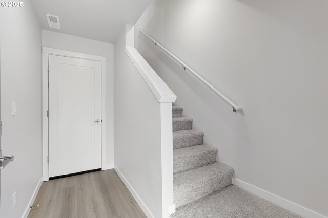 15093 SE Division St, Portland, OR 97236 - staircase featuring baseboards and wood finished floors