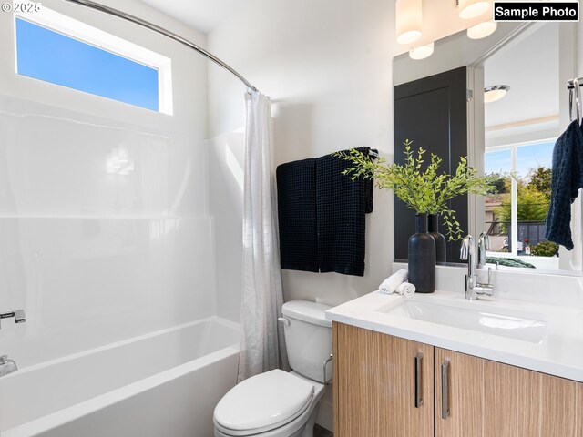 3001 NE Ainsworth St, Portland, OR 97211 - full bathroom with a healthy amount of sunlight, vanity, toilet, and shower / tub combo with curtain