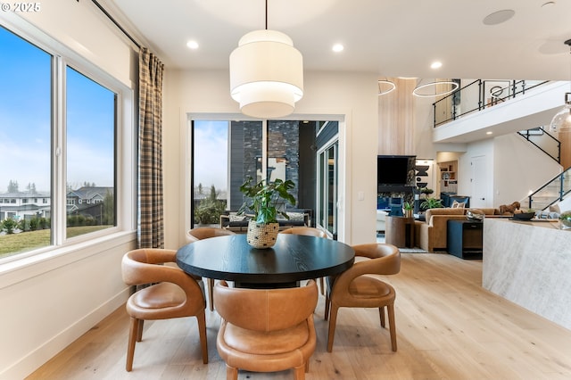 dining area with light hardwood / wood-style floors