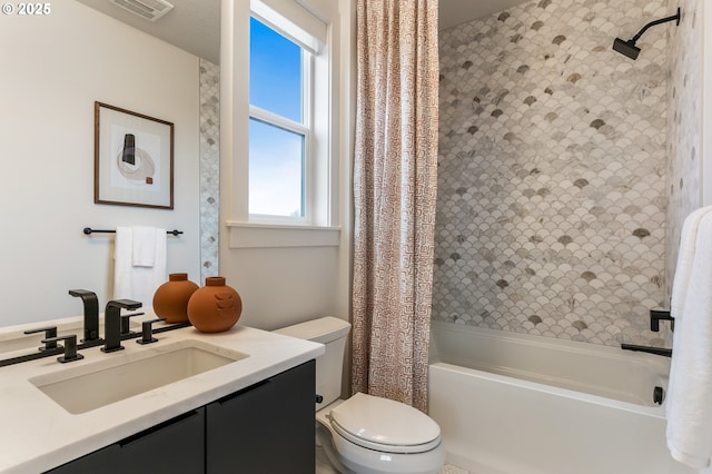 full bathroom with shower / bath combo with shower curtain, vanity, and toilet