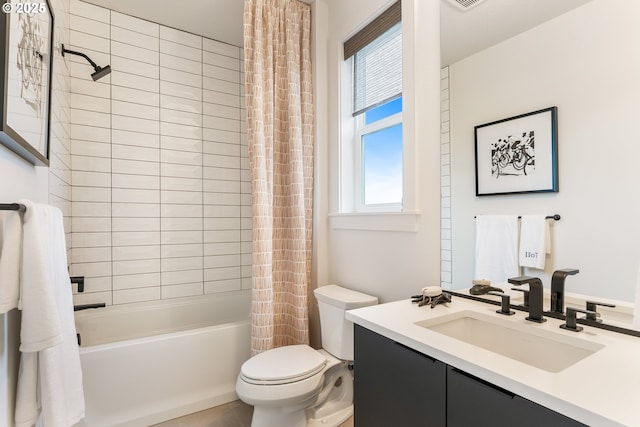 full bathroom featuring vanity, shower / bathtub combination with curtain, and toilet