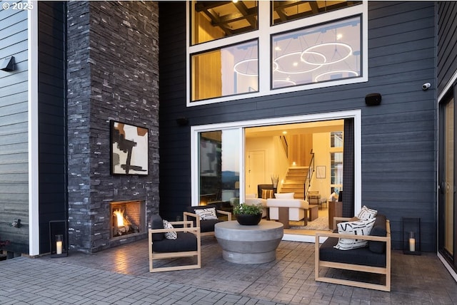 view of patio / terrace with an outdoor stone fireplace