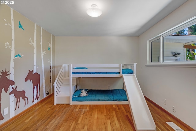 13015 E Burnside St, Portland, OR 97233 - bedroom featuring wood finished floors and baseboards