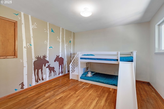 13015 E Burnside St, Portland, OR 97233 - bedroom featuring wood finished floors and baseboards