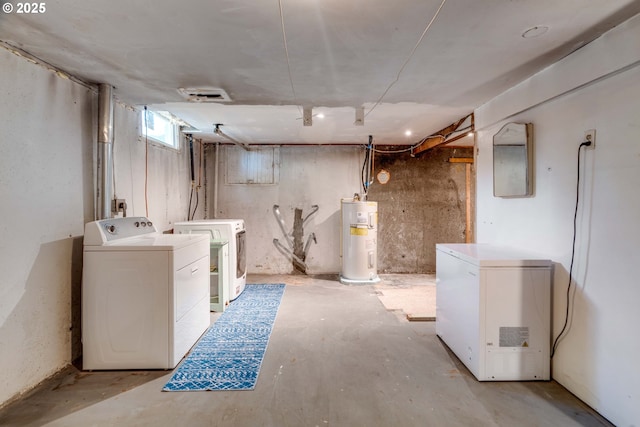 13015 E Burnside St, Portland, OR 97233 - below grade area featuring electric water heater, fridge, and washing machine and clothes dryer