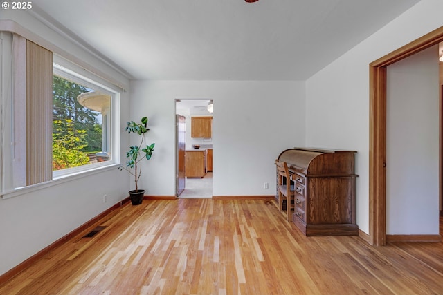 13015 E Burnside St, Portland, OR 97233 - unfurnished room with light wood-style floors and baseboards