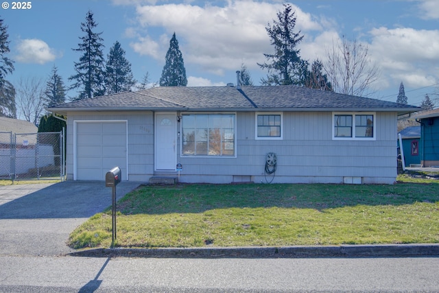 ranch-style home with a garage and a front yard