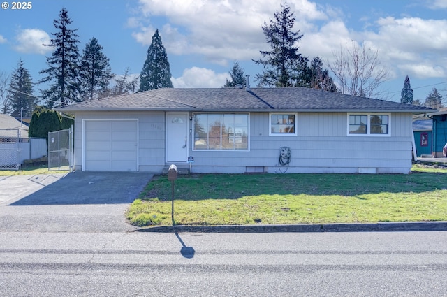 single story home with a garage and a front lawn